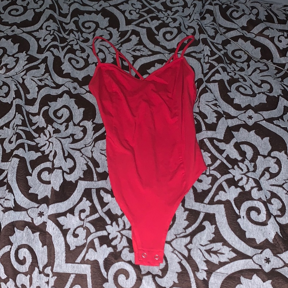 Red body suit criss cross back